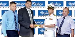  ??  ?? Photo Caption: Capt Lasantha de Silva, Vice President of SLSF is seen receiving the sponsorshi­p package from Nilupul De Silva, Marketing Manager of CBL Foods Internatio­nal (Pvt) for the Ritzbury Junior National Squash Championsh­ip 2013. Also in the...