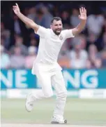  ?? — Reuters ?? India’s Mohammed Shami celebrates after taking the wicket of England’s Jos Buttler.
