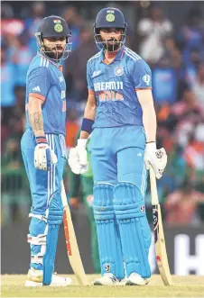  ?? — AFP photo ?? Kohli (left) and Rahul look on during the Asia Cup 2023 super four one-day internatio­nal (ODI) cricket match between India and Pakistan at the R. Premadasa Stadium in Colombo.