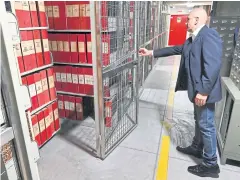  ?? AFP ?? An attendant opens the section of the archive dedicated to Pope Pius XII on Thursday in the Vatican Apostolic Secret Archive.