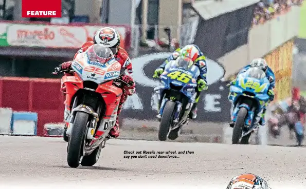  ??  ?? Check out Rossi's rear wheel, and then say you don't need downforce...