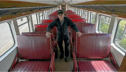  ??  ?? Fielding and Districts Steam Rail Society member Kevin De Rose in one of the carriages trashed last month by vandals.