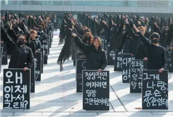  ??  ?? Protesters holding signs with phrases heard from Me Too skeptics, such as ‘Why are you only coming forward now?’ and ‘A sane woman would’ve quit right away,’ Seoul, November 2018