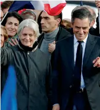  ?? AFP ?? Francois Fillon and wife Penelope attend a meeting at the Trocadero square across from the Eiffel Tower in Paris. —