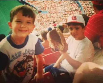  ??  ?? A young Tom Power, left, takes in a Jays game with his cousin. Power grew up in a musical family.