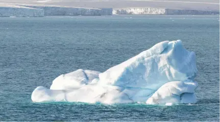  ?? 123RF ?? An iceberg floats near Philpots Island in Nunavut. As a northern country, Canada will be among the first to feel the impacts of climate change, says Brian Hodder.