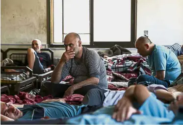  ?? — AFP ?? Struggling to
cope: Patients resting at the mental health clinic in Azaz.