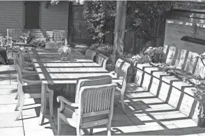  ??  ?? A pergola casts a shadow over the dining space in Boehning’s yard.