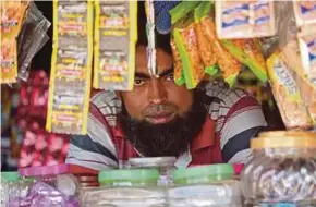  ?? REUTERS PIC ?? A Rohingya man at his shop at a camp on the outskirts of Jammu on Friday.