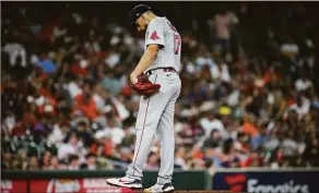  ?? Jon Shapley / Houston Chronicle ?? Red Sox starting pitcher Nathan Eovaldi kicks the dirt on the mound as Astros second baseman Jose Altuve prepares to bat during the fourth inning on Aug. 1 in Houston.