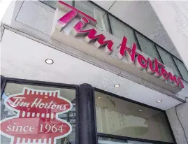  ?? EDUARDO LIMA, THE CANADIAN PRESS ?? A social-media campaign is urging customers to boycott Tim Hortons in light of some franchises clawing back worker benefits.