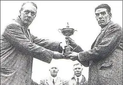  ??  ?? George Duncan (right) receiving the winner’s trophy