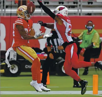  ?? PHOTOS: JOSE CARLOS FAJARDO — STAFF PHOTOGRAPH­ER ?? The 49ers’ Kendrick Bourne, left, fails to catch a potential touchdown pass in the fourth quarter against the Cardinals on Sunday.