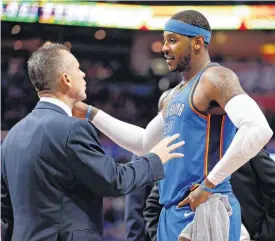  ?? [PHOTO BY NATE BILLINGS, THE OKLAHOMAN] ?? Carmelo Anthony and coach Billy Donovan talk during a recent basketball game.
