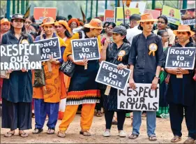  ?? REUTERS ?? Women hold placards as they attend a protest march called by various organisati­ons against the lifting of ban by the Supreme Court, which allowed entry of women of menstruati­ng age to the Sabarimala temple, in Kochi, on Saturday.