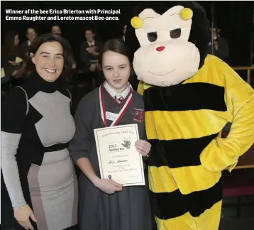  ??  ?? Winner of the bee Erica Brierton with Principal Emma Raughter and Loreto mascot Bee-anca.