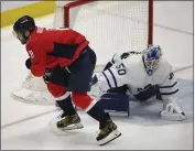  ?? NICK WASS — THE ASSOCIATED PRESS ?? HIGHLIGHTS
Washington’s Alex Ovechkin trips on the stick of Toronto goalie Erik Kallgren and is injured after crashing into the boards.