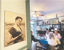  ?? ?? A photo of Edie Rae Olsen taken by millworker and amateur photograph­er Frank Dixon hang on the walls of the kitschy café named after her.
