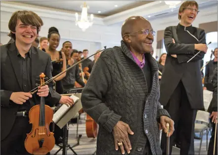  ??  ?? Archbishop Desmond Tutu with the SA Youth Orchestra in 2016.