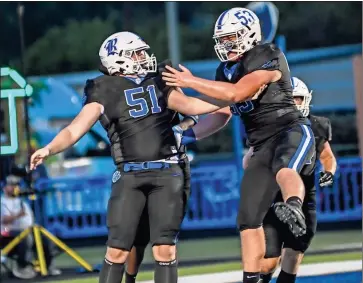  ?? ♦ Courtney Couey, Ringgold Tiger Shots ?? Ringgold’s Brady Gray (51) celebrates with teammate Levi Gunn after Gray’s fumble return for a touchdown in the win over LFO. It was one of three defensive touchdowns scored by the Tigers in the game.
CORRECTION: In a photo on page B1 in the Sept. 15 edition, Heritage High School football player Landon Cansler was incorrectl­y identified. Cansler was wearing jersey No. 5 during the game against Christian Heritage.