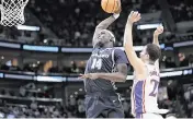  ?? ROB GRAY USA TODAY Sports ?? Samford Bulldogs forward Achor Achor (14) dunks against Kansas Jayhawks guard Nicolas Timberlake (25) during the second half in the first round of the 2024 NCAA Tournament at Vivint Smart Home Arena-Delta Center.