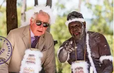  ??  ?? Left: ThePrince of Wales chats to an Indigenous elder. Below: Arriving for a traditiona­l ceremony.