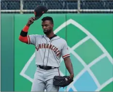  ?? AP Photo/Gene J. PUSKAR ?? San Francisco Giants’ Andrew McCutchen acknowledg­es fans as he takes right field for the first inning of a baseball game against the Pittsburgh Pirates in Pittsburgh, on Friday.