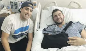  ?? HUDSON MACK VIA CP ?? Sheldon Mack, right, with paramedic Jimmy Grovom. Mack was shot in the forearm and abdomen Sunday in Las Vegas.