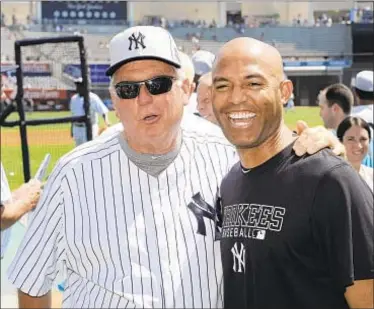  ?? DAILY NEWS PHOTO ?? Tommy John (here with Mariano Rivera) has been fixture at Old Timers’ Day.