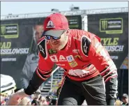  ?? TERRY RENNA — THE ASSOCIATED PRESS FILE ?? In this Nov. 19, 2017, file photo, Dale Earnhardt Jr. interacts with fans during driver introducti­ons before a NASCAR Cup Series auto race at Homestead-Miami Speedway in Homestead, Fla. Dale Earnhardt Jr. is returning to the track Saturday, June 13, 2020, getting behind the wheel for an Xfinity race at Homestead-Miami Speedway — the place where his Cup Series career ended three years ago.