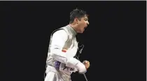  ?? Elsa / Getty Images ?? U.S. fencer Alexander Massialas exults during the men’s team foil bronzemeda­l match against Takahiro Shikine.