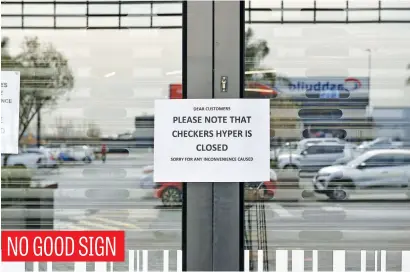  ?? Picture: Neil McCartney ?? A sign at the Checkers Hyper in Meadowdale Mall, Edenvale, that closed its doors after a positive case of Covid-19 was found during an employee screening programme. A profession­al decontamin­ation company has been called to sanitise and clean the store.