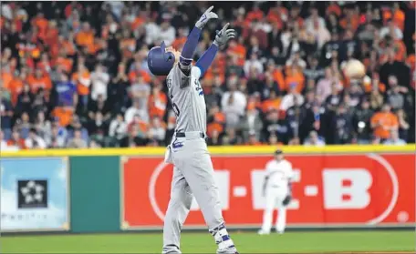  ?? Wally Skalij Los Angeles Times ?? HITLESS for the first three games, Cody Bellinger reacts after a seventh-inning double. He scored the tying run and added an RBI double.