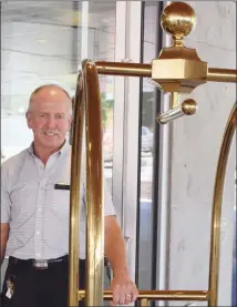  ?? JAMES MILLER/The Okanagan Weekend ?? Bellman Brad Foster, one of the few original employees from when the Penticton Lakeside Resort opened in the 1980s, welcomed the first guests to the new hotel expansion, Friday.