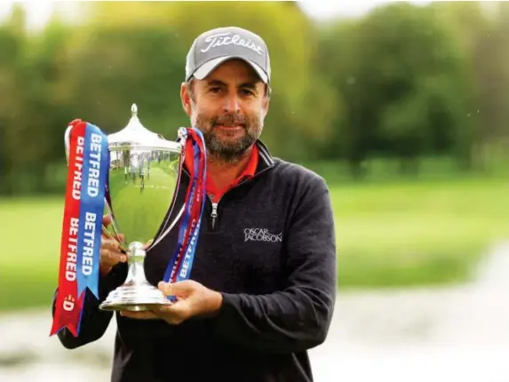  ?? (Getty) ?? The 48-year-old poses with the trophy at the British Masters