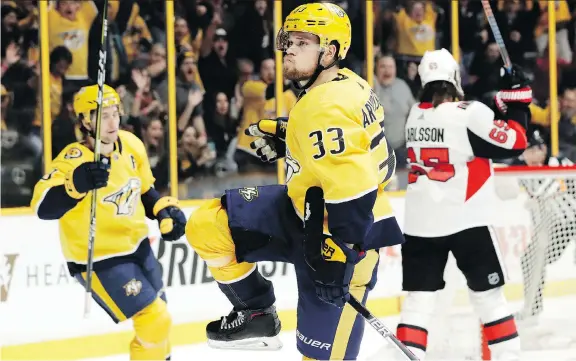  ?? PHOTOS: MARK HUMPHREY/THE ASSOCIATED PRESS ?? The Senators’ Erik Karlsson, right, prepares to smash his stick after the Predators’ Viktor Arvidsson, centre, scored in Monday’s game in Nashville.