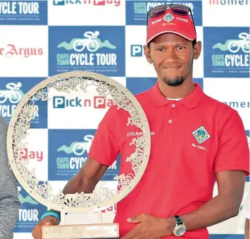  ?? PICTURE: HENK KRUGER ?? PROUD WINNER: Clint Hendricks, the winner of the 39th Cape Town Cycle Tour on Sunday, in a time of 2:35:35, received his award at a ceremony in the city yesterday. The race’s other category winners were also handed their prizes.