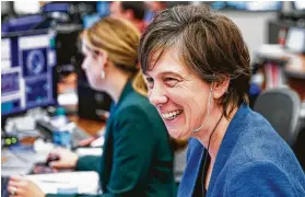  ?? Michael Ciaglo / Staff photograph­er ?? NASA Chief Flight Director Holly Ridings says a calm settles over her when she dons her headset on the control room floor.