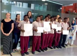  ??  ?? Cleaners, gardeners and security guards at the American University of Sharjah get a six-week class on basic English. From August onwards, student volunteers will also be part of the initiative.