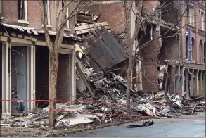  ?? Andrew Nelles / The Tennessean via AP Pool ?? A view of some of the buildings damaged in a Christmas Day explosion in Nashville, Tenn. Officials are continuing to assess building damage caused by the blast. Phone and data disruption­s have prompted concerns over the vulnerabil­ity of U.S. communicat­ions systems.