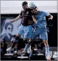  ?? MICHAEL REAVES — GETTY IMAGES ?? Colorado’s Keegan Rosenberry, left, and Sporting Kansas City’s Ilie Sanchez battle for a header Friday during Kansas City’s 3-2 victory.