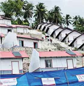  ?? RALPH MARTINEZ ?? NEW HOMES. The Philippine Red Cross has allocated P32 million for the constructi­on of solar-powered houses for the 71 victims of Typhoon Odette (Rai) in Alegria, Cebu. /