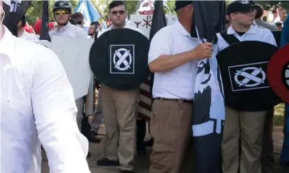  ??  ?? James Alex Fields, second left with shield, at the “Unite the Right” rally in Charlottes­ville, Virginia on 12 August 2017. Photograph: Stringer ./ Reuters