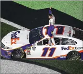  ?? BRIAN LAWDERMILK — GETTY IMAGES ?? Denny Hamlin celebrates after winning the Monster Energy NASCAR Cup Series Daytona 500at Daytona Internatio­nal Speedway. Hamlin also won in 2016.