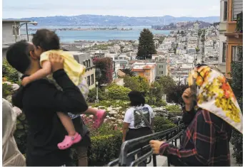  ?? Photos by Brontë Wittpenn / The Chronicle ?? A view from highpriced Russian Hill in San Francisco. Home shoppers leaving the city are often looking farther away now that the pandemic made working from home more common.
