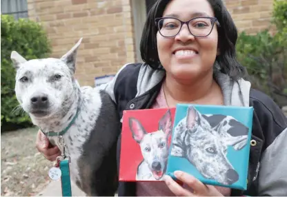  ?? LM OTERO/ AP ?? Danielle Moore and her dog Kana pose by paintings of the pet Australian cattle dog in Dallas. In the dog- eat- dog world of online shopping, Chewy has an unusual plan to fend off Amazon: turning pets into works of art.