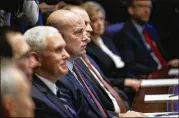  ?? EVAN VUCCI / ASSOCIATED PRESS ?? Vice President Mike Pence and acting Attorney General Matt Whitaker listen with other officials as President Donald Trump speaks during a Cabinet meeting Wednesday in the White House.