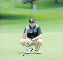  ?? JAMES PARK / OTTAWA CITIZEN ?? Taylor Pendrith of Richmond Hill, Ont., checks for the angle at the final hole at National Capital Open to Support Our Troops at Hylands Golf Club on Friday.