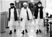  ?? PHOTO: AP/PTI ?? From left: Suhil Shaheen, Shahabuddi­n Delawar, and Mohammad Naim, members of a Taliban delegation, arrive for a press conference in Moscow on Friday