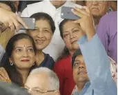  ?? — ASIAN AGE ?? Guests take a selfie with Rajasthan chief minister Vasundhara Raje at Parliament House in New Delhi on Tuesday.